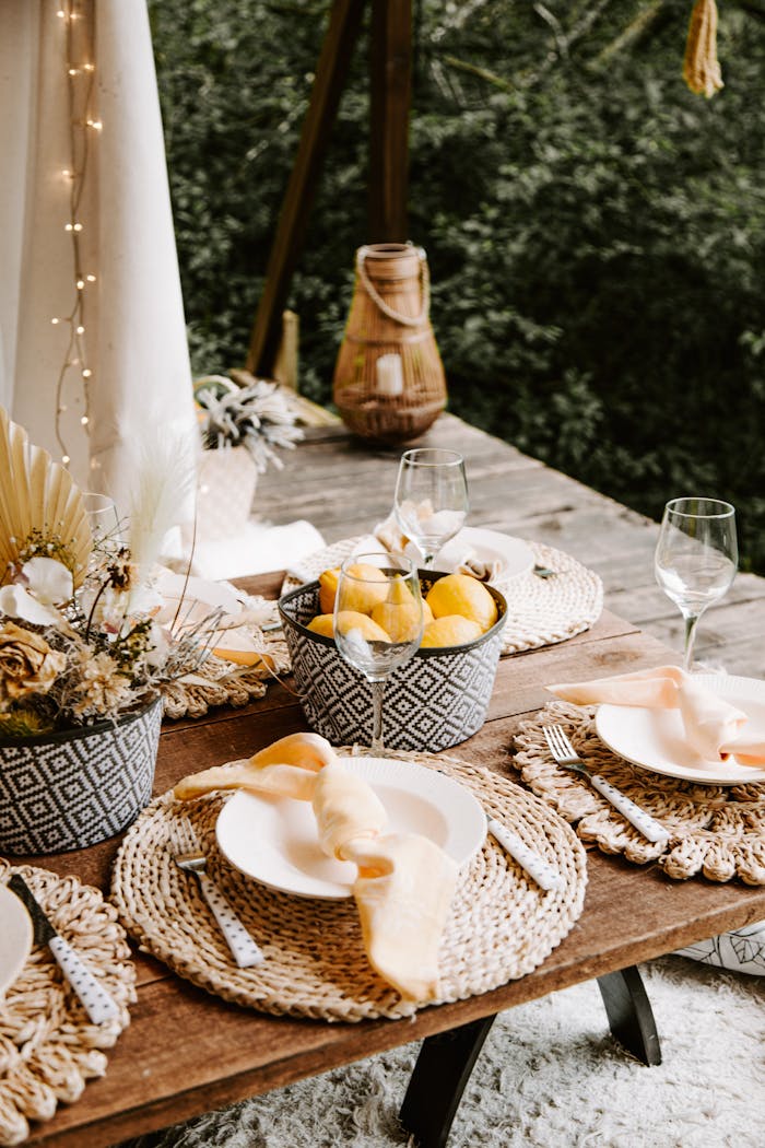Elegant outdoor table setting with lemons and floral decor in Sigulda, Latvia.